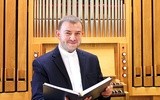 Ks. mgr lic. Adam Kozak jest wykładowcą w Diecezjalnej Szkole Organistowskiej II stopnia i Studium Muzyki Kościelnej w Gliwicach. Święcenia kapłańskie przyjął w 2007 roku  w Gliwicach. W latach 2010–2015 studiował muzykologię i liturgikę na KUL. Jest członkiem komisji synodalnej ds. liturgii.