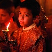  13.04.2014. Autonomia Palestyńska. Palestyńskie dzieci podczas procesji w Niedzielę Palmową w kościele św. Porfiriosa w Gazie