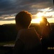 Zdjęcie zostało wykonane w Polsce w miejscowości Murzasichle (koło Zakopanego) i przedstwia mnie i moją mamę patrzące na oddalone szczyty Tatr podczas zachodu słońca.