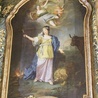 ▲	Obraz zawieszony w ołtarzu głównym kościoła pw. św. Tekli w Pławnej.